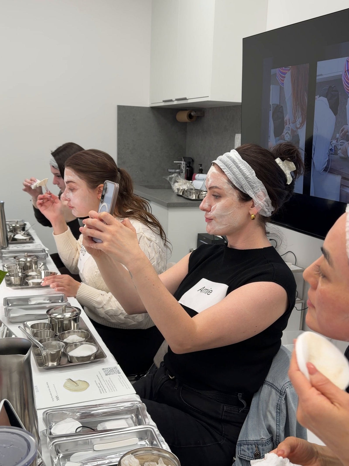 Creators testing a masque at Creator's Lab and filming it on their phones