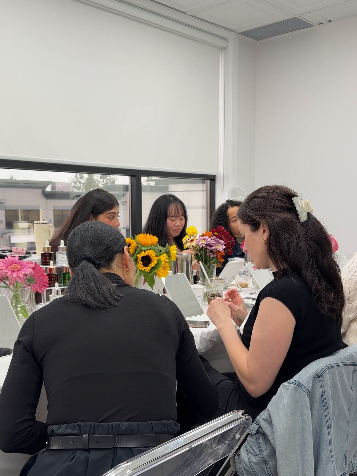 Creators seated around a shared table at a Creator's Lab session