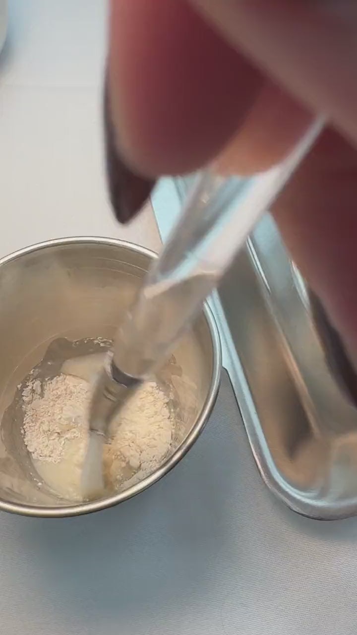Mixing a masque by hand in a steel bowl