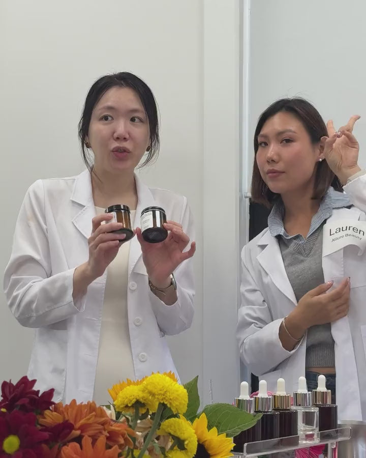 Founder demonstrating products to a creator at Creator's Lab, flowers and product display in front