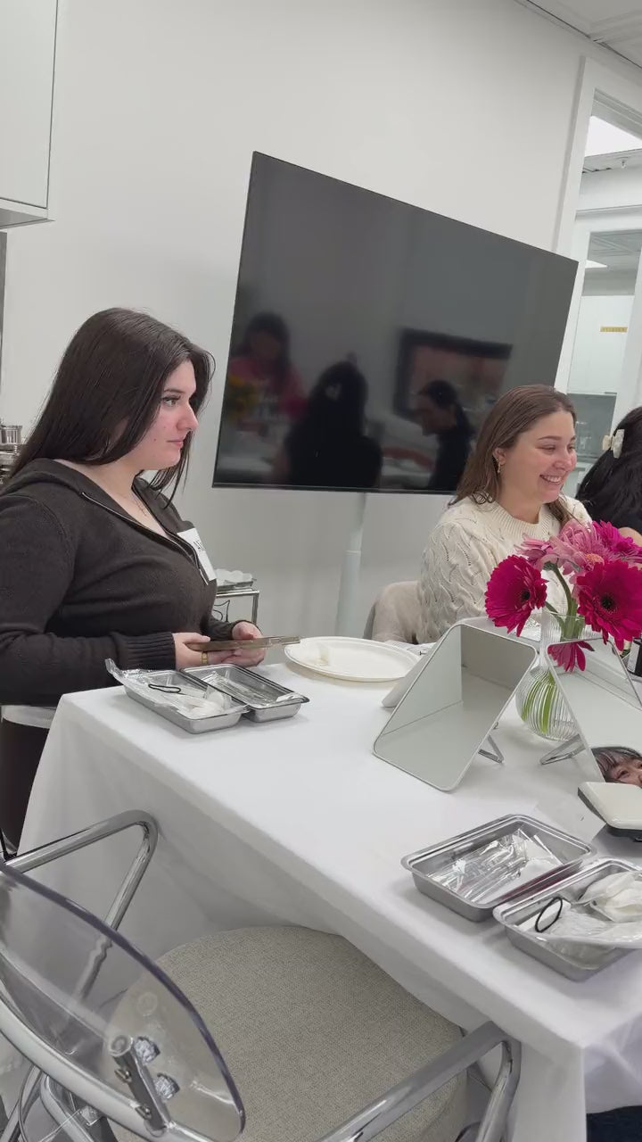 A creator filming content at the table